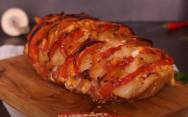 рецепт Мясо гармошка в духовке  из свинины с помидорами и сыром